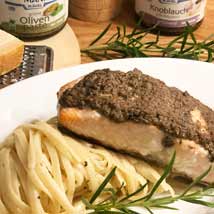 Salmon fillet with olive paste on linguine